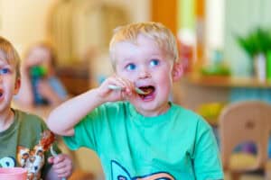 Children eating meatballs 2